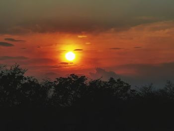 Scenic view of dramatic sky during sunset