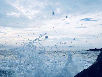 Scenic view of sea against sky during winter