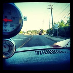 Road seen through car windshield