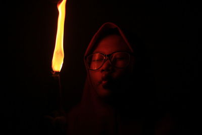 Close-up of man in darkroom