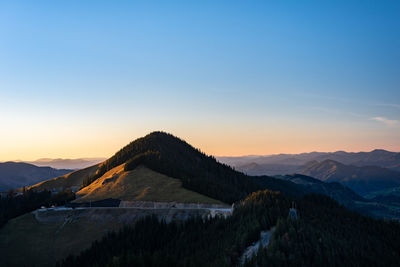 Scenic view of mountains against sky during sunset