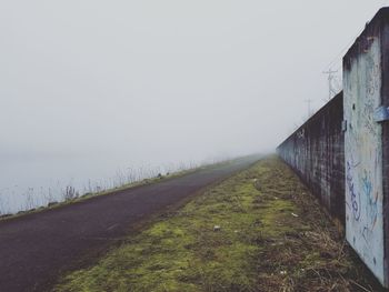 Road amidst landscape against clear sky