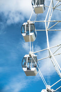 Low angle view of floodlight against blue sky