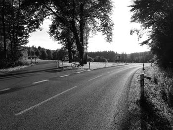 Road by city against sky