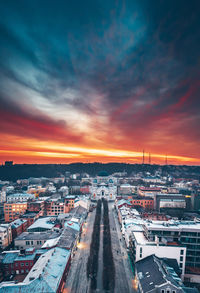 High angle view of buildings in city against sky during sunset