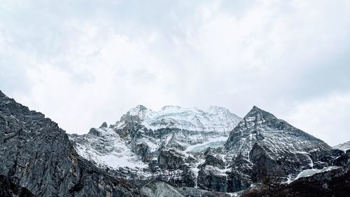Panoramic view of snowcapped mountains against sky