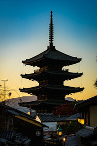 Low angle view of pagoda against sky in city