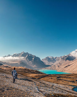 Scenic view of mountains against clear blue sky