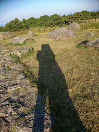 Shadow of man on rock