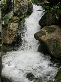 Water flowing through rocks in sea