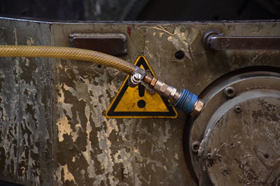 Close-up of padlock on rusty metal