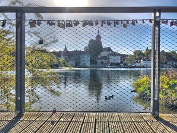 Lake seen through chainlink fence