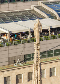 Low angle view of statue against building