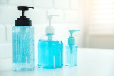 Close-up of blue glass bottles on table