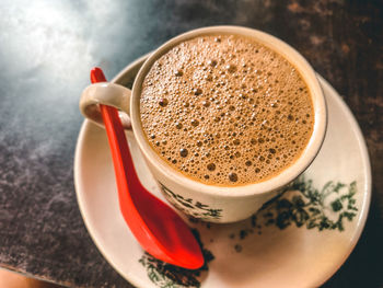 High angle view of coffee cup on table