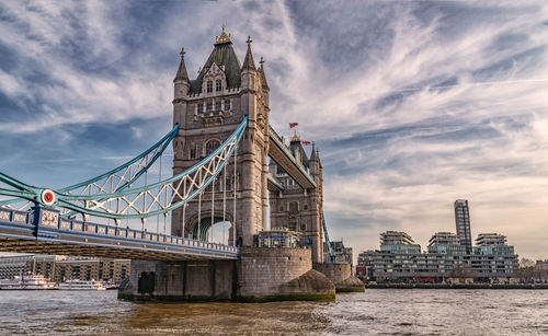 View of bridge over river with city in background