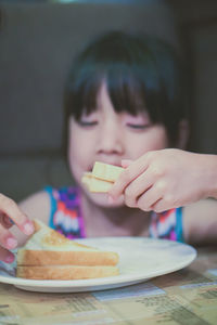 Close-up portrait of boy eating food