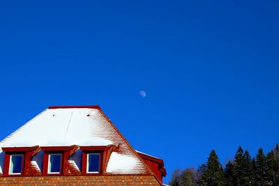 Low angle view of building against clear blue sky