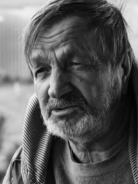 Elderly bearded village man close-up face