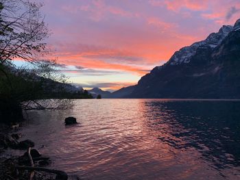 Scenic view of lake against orange sky