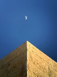 Low angle view of building against blue sky