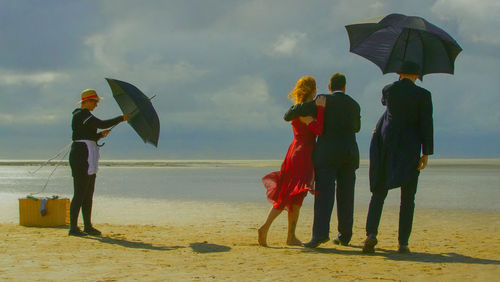 People standing on beach