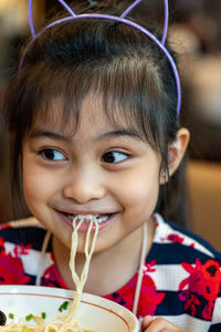 Close-up portrait of smiling girl