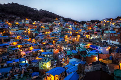 High angle view of illuminated buildings in city