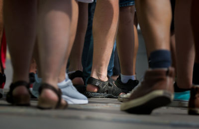 Low section of people standing on floor