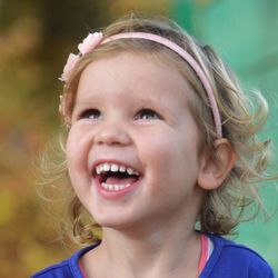 Close-up of cute girl smiling