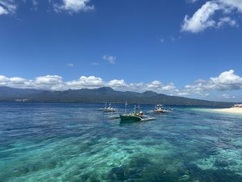 Scenic view of sea against blue sky