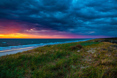 Scenic view of sea against sky during sunset