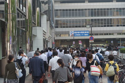 Group of people walking in city