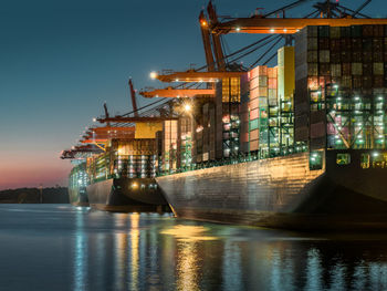 Illuminated cargo container moored dock