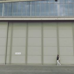 Full length of a man walking on road