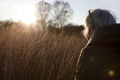 Rear view of woman against sky