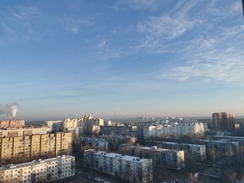 High angle view of city buildings against sky