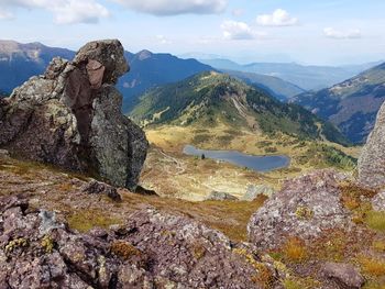 Rock formation on landscape against sky