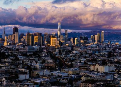 Cityscape against sky during sunset