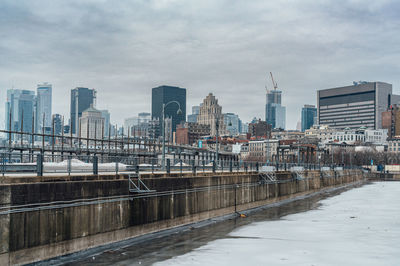 Buildings in city against sky