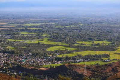 High angle view of agricultural field and buildings