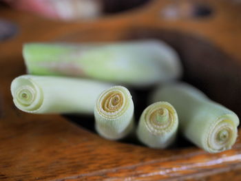 High angle view of leek in wooden container