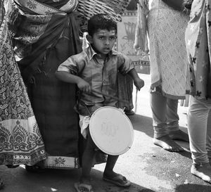 Children standing in traditional clothing