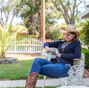 Full length of woman sitting in park