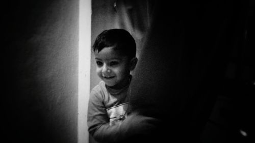 Portrait of boy looking at home