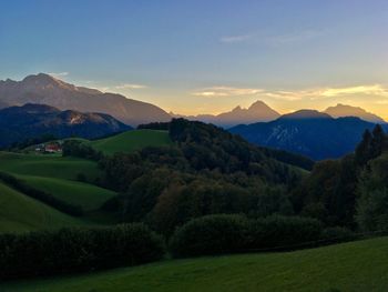 Scenic view of landscape against sky during sunset