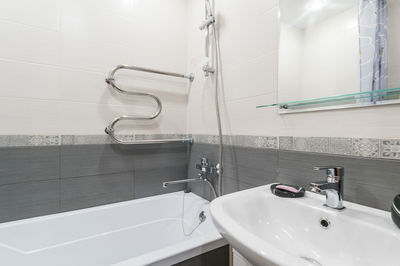 Close-up of faucet in bathroom at home