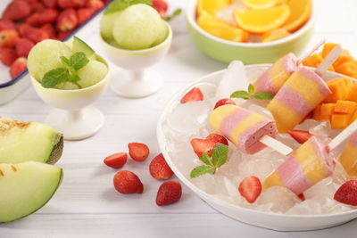 High angle view of fruits in plate on table