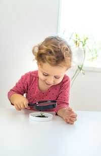 Boy playing with toy on table