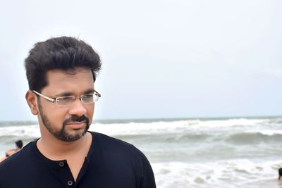 Portrait of young man on beach